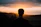silhouette of a man facing the sunset