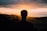 silhouette of a man facing the sunset
