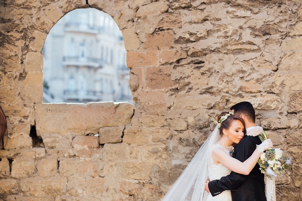 man and woman hugging each other