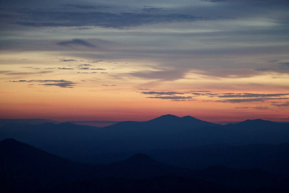 silhouette mountain and gray clouds