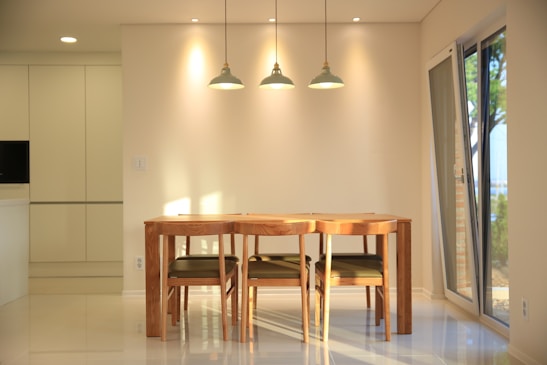 A bright dining area with a modern dining table and chairs.