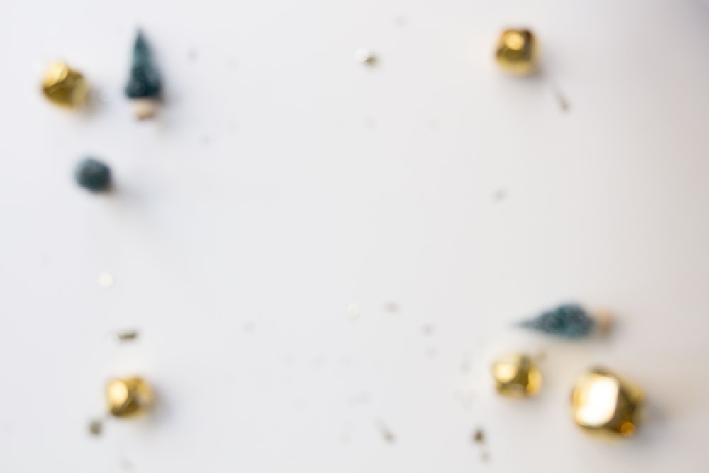 a white table topped with lots of gold decorations