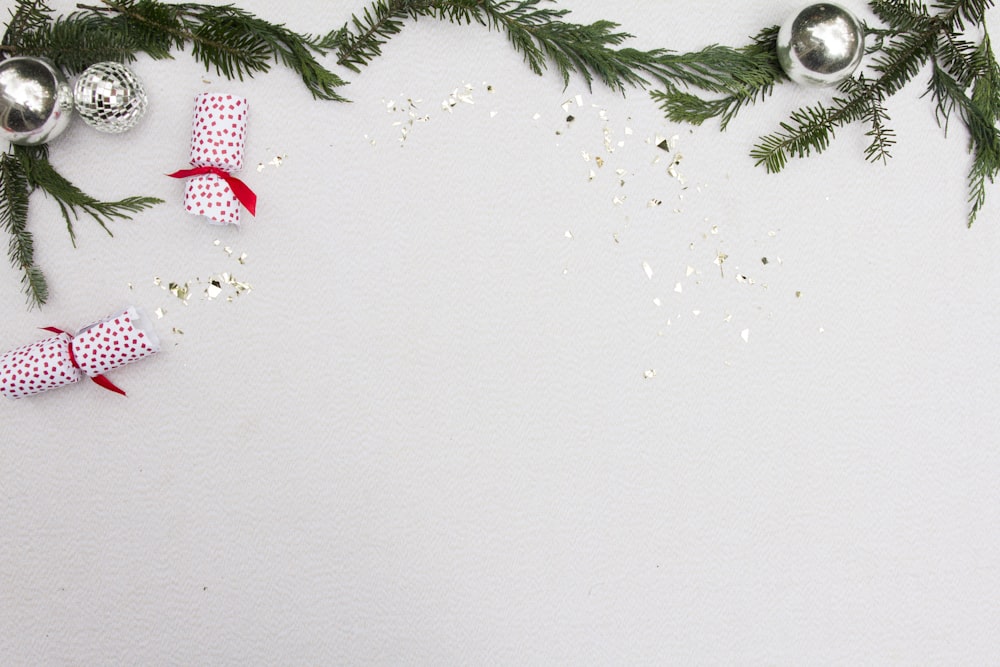 a white table topped with christmas decorations and ornaments