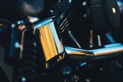 Engine oil pouring smoothly into a motorcycle engine with yellow accents