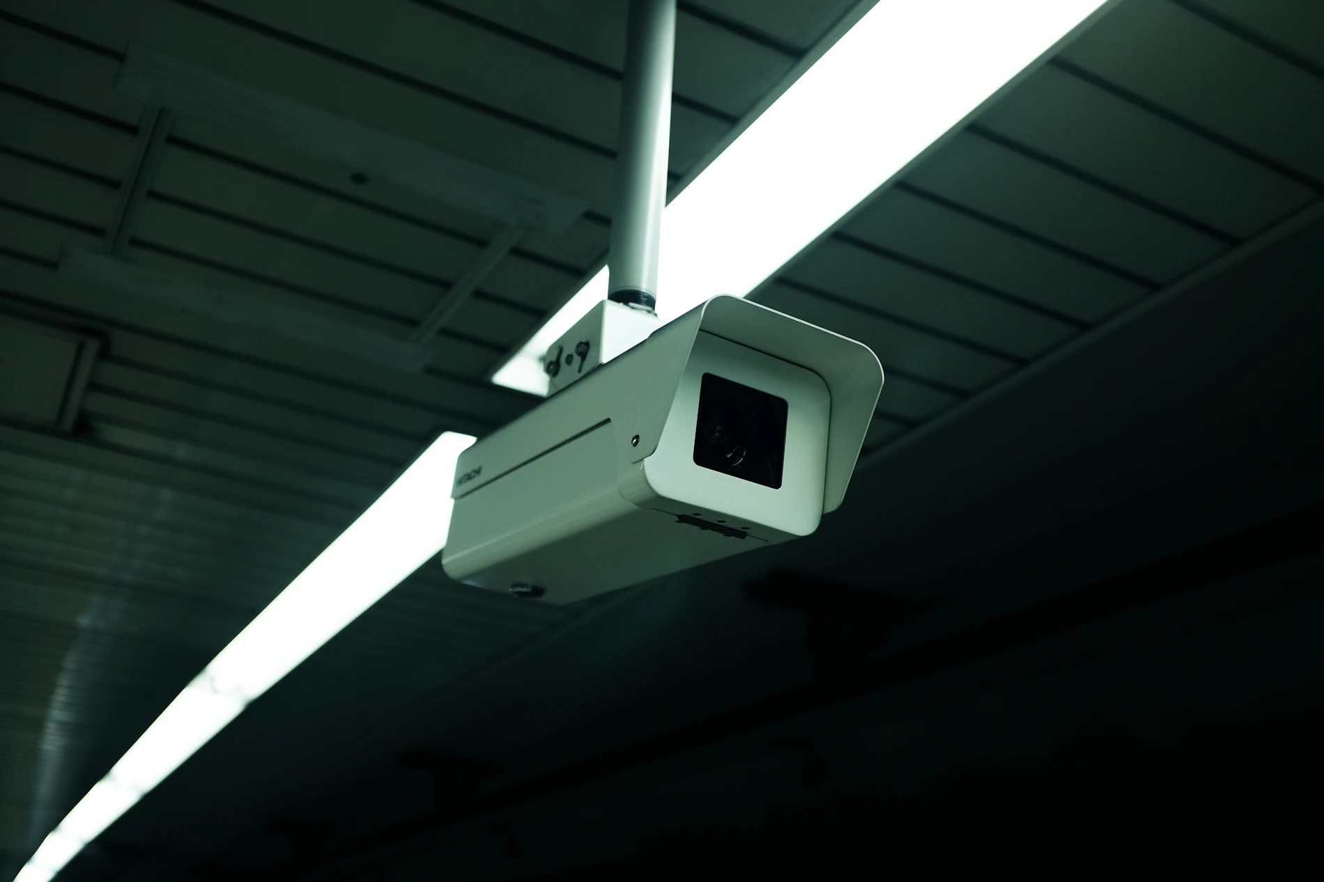 Security camera mounted on a dark wall