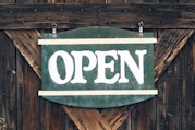 green and white open signage