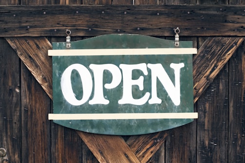 green and white open signage