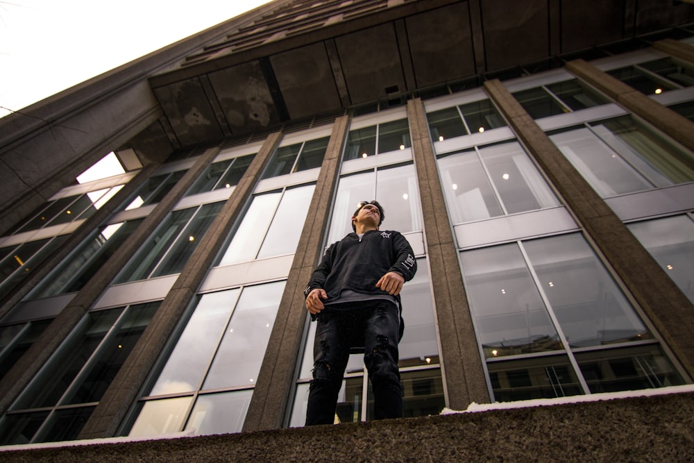 man standing near window