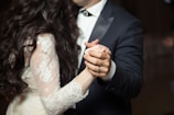 A couple sharing a dance during their wedding reception.