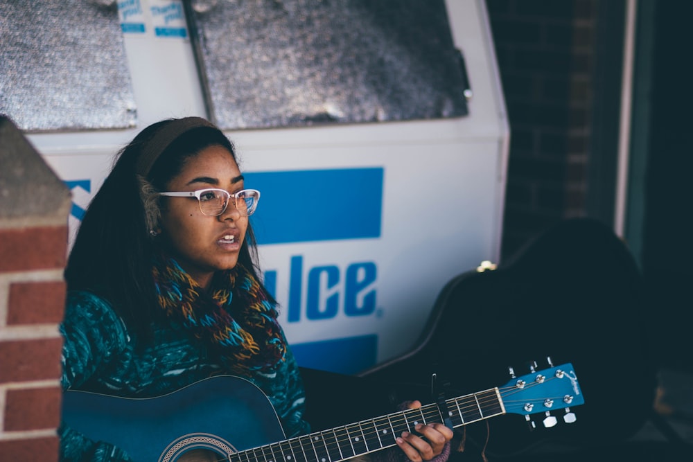 woman playing guitar