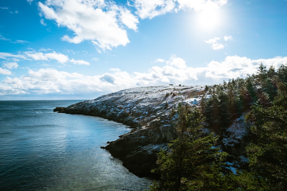 bird's eye view of snowy seaside mountain