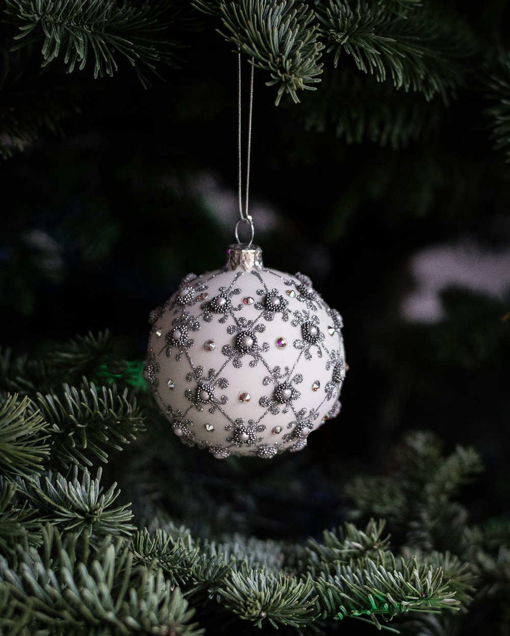 white and gray Christmas baubles