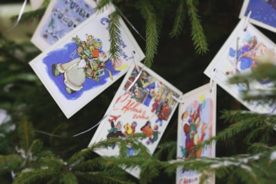 Colorful printable Christmas activity sheets with festive illustrations of trees and gifts.