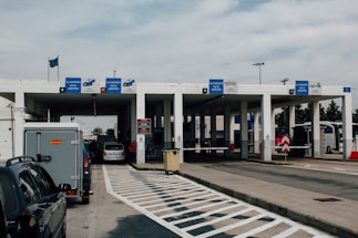 A friendly customs officer assisting a traveler at the border checkpoint.