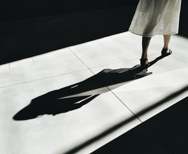 woman walking with shadow