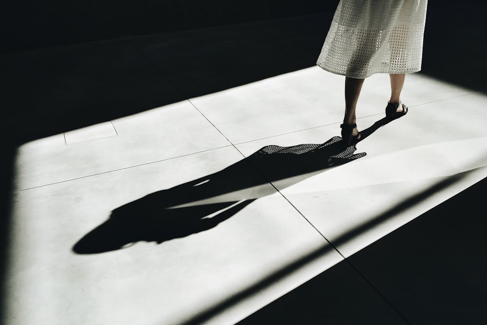 woman walking with shadow