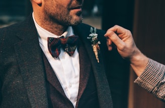 man wearing black suit jacket