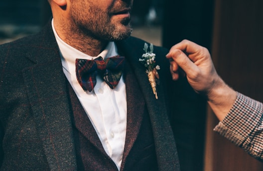 man wearing black suit jacket