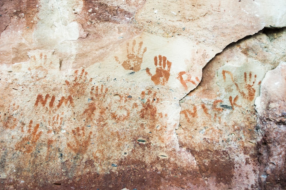 hand prints on gray concrete wall