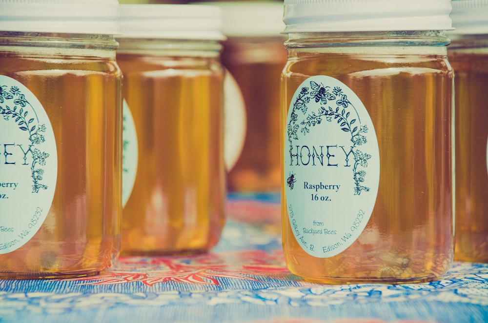 Jars of local honey with decorative labels