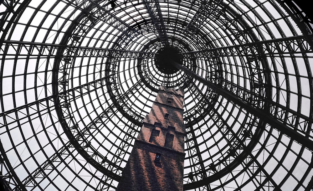 low angle photography of black metal framed tower