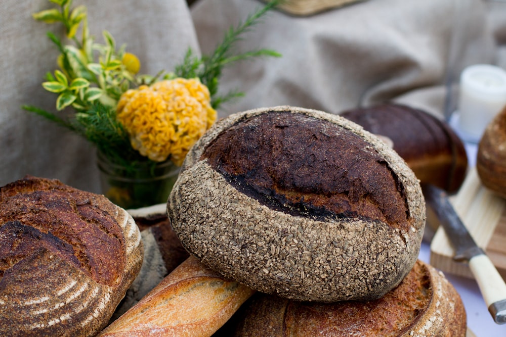 leaven bread beside the yellow petaled flower