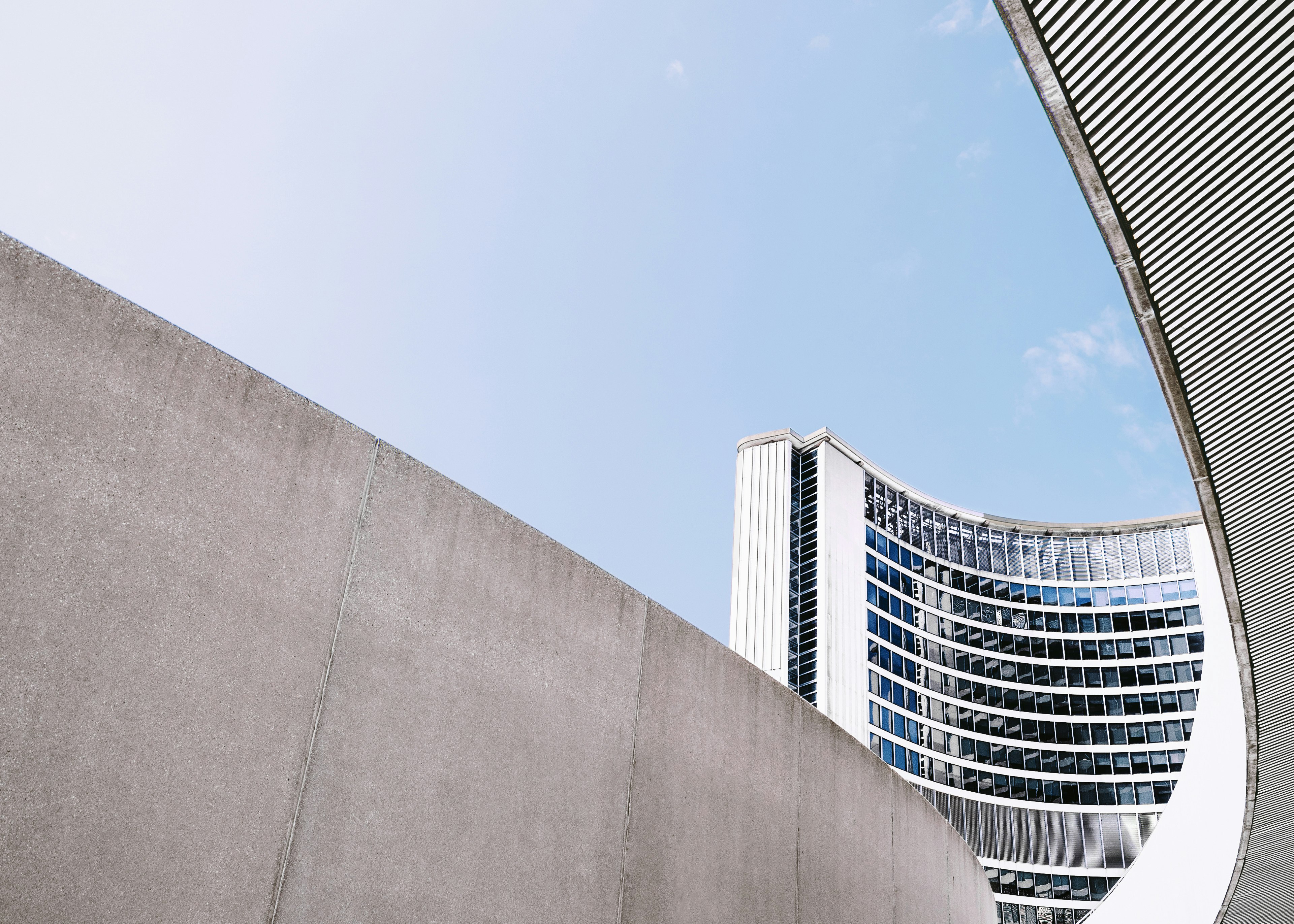 Concrete walls near the curved building of Toronto City Hall