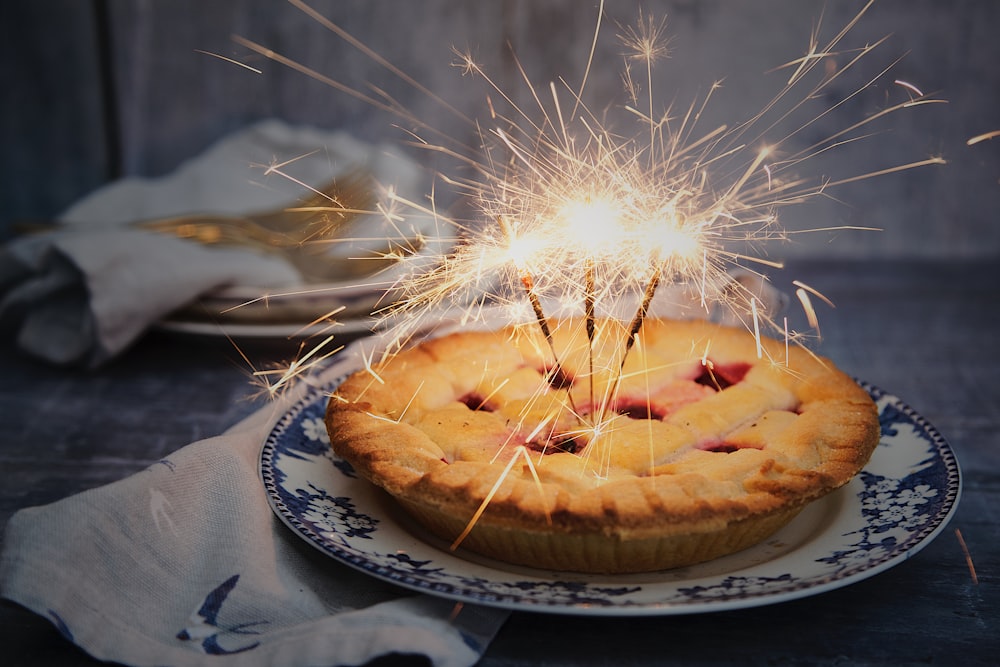 brown pie with sparklers on top