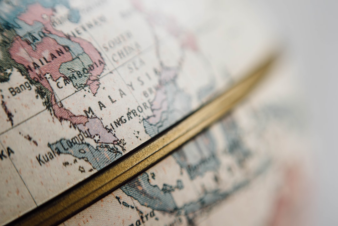 closeup photo of world globe, Golden equator