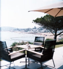A scenic view of a coastal venue with people enjoying the outdoors.