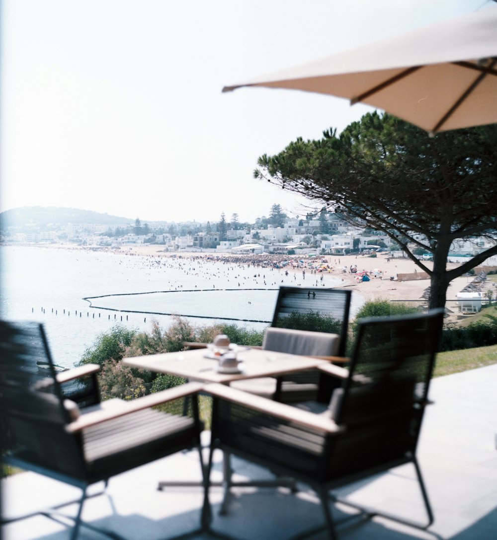 square brown table and four chairs patio set