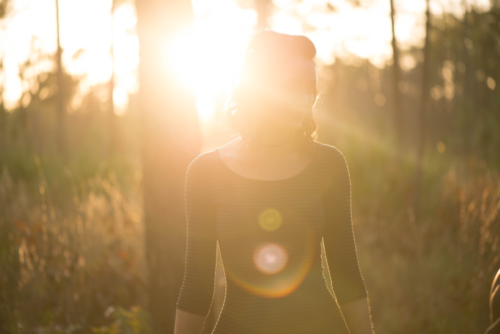 woman standing grass field