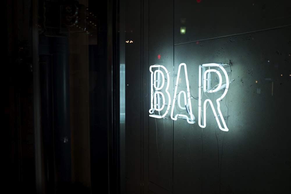 photo of turn-on white bar neon sign