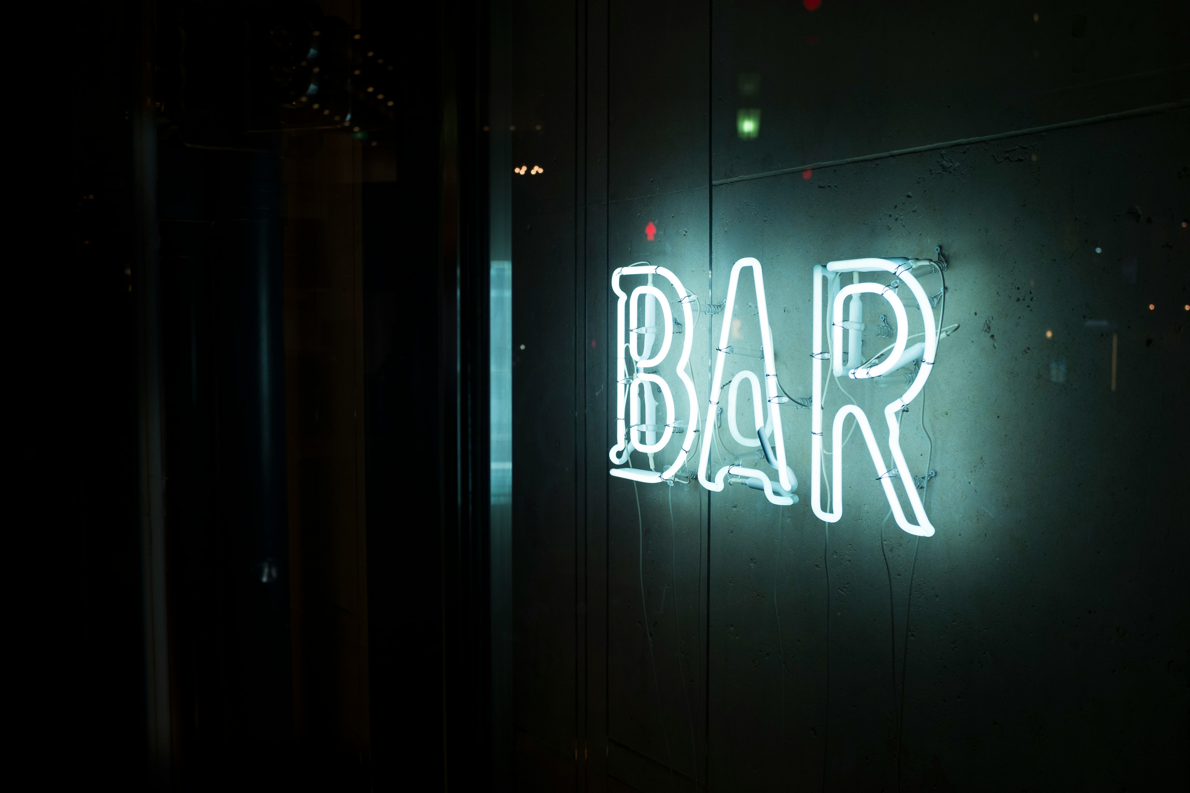 photo of turn-on white bar neon sign