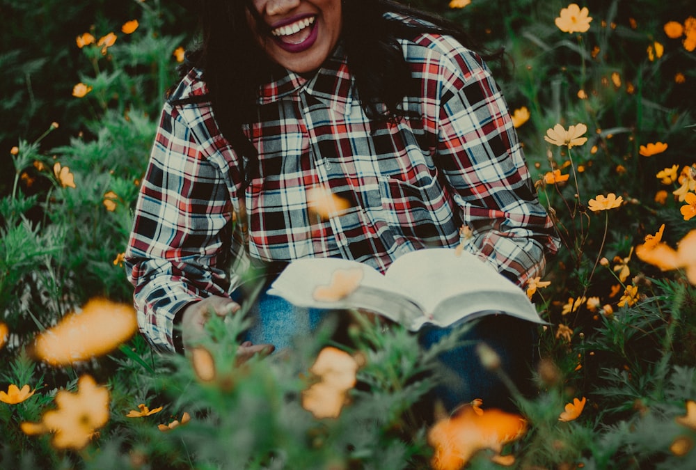 woman in a black, white and red plaid dress shirt