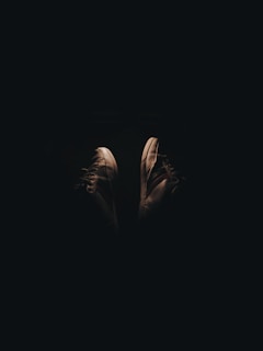 Lunakicks sneakers displayed in an artistic setup with a focus on their glowing elements.