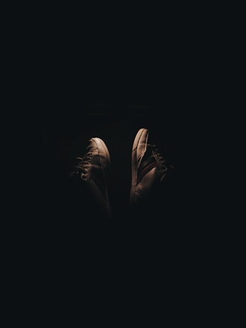 Lunakicks sneakers displayed in an artistic setup with a focus on their glowing elements.