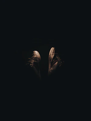 Close-up of trendy sneakers with dynamic lighting highlighting their design
