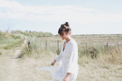 Woman walking outdoors in a fresh, breezy georgette dress under soft sunlight.