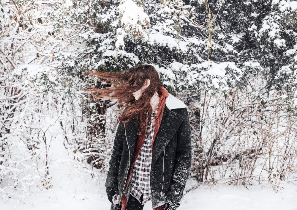 woman facing sideways with hair covering her face