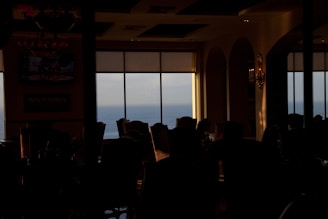 Cozy dining area with ocean view and elegant nautical decor at Ocean’s Seafood and Grill.