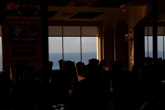 Elegant onboard dining experience with ocean views and ambient lighting.