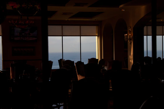 A serene spa reception area with soft lighting and calming ocean-themed decor.