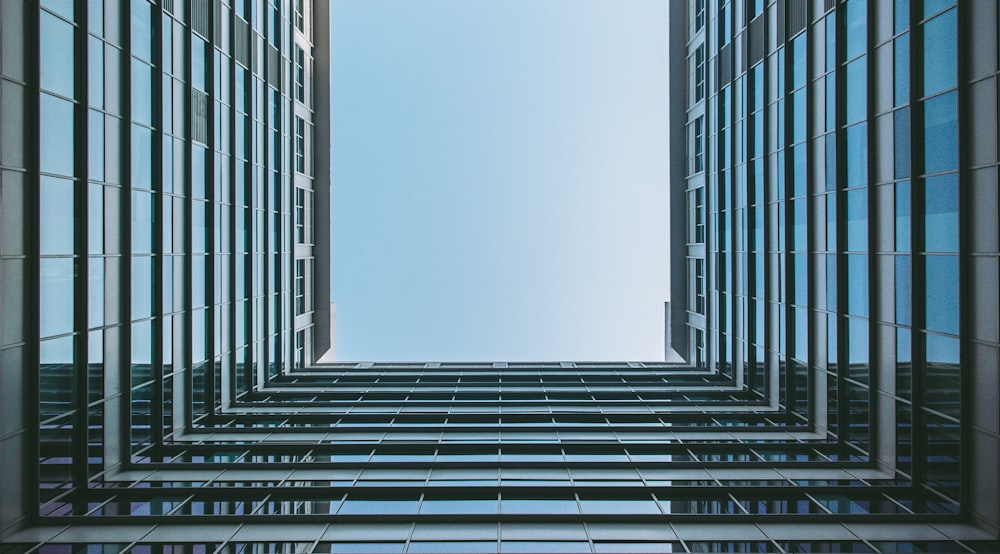 worm's eye view photography of glass building