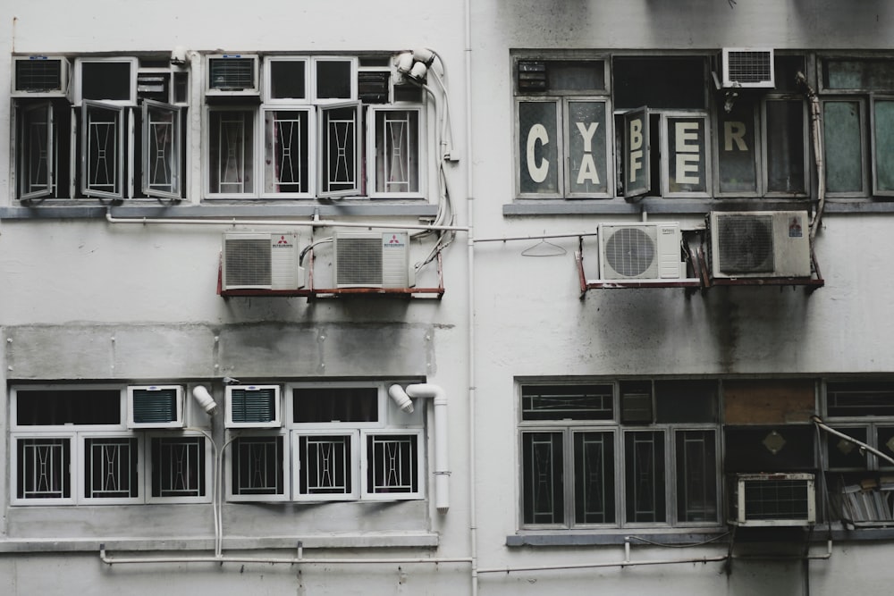 white window-type air conditioner on wall