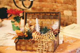 Handcrafted artisan basket filled with decorative items on a wooden table.