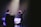 A student performing on stage during a music recital.