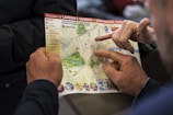 two people pointing at London's number one sightseeing map
