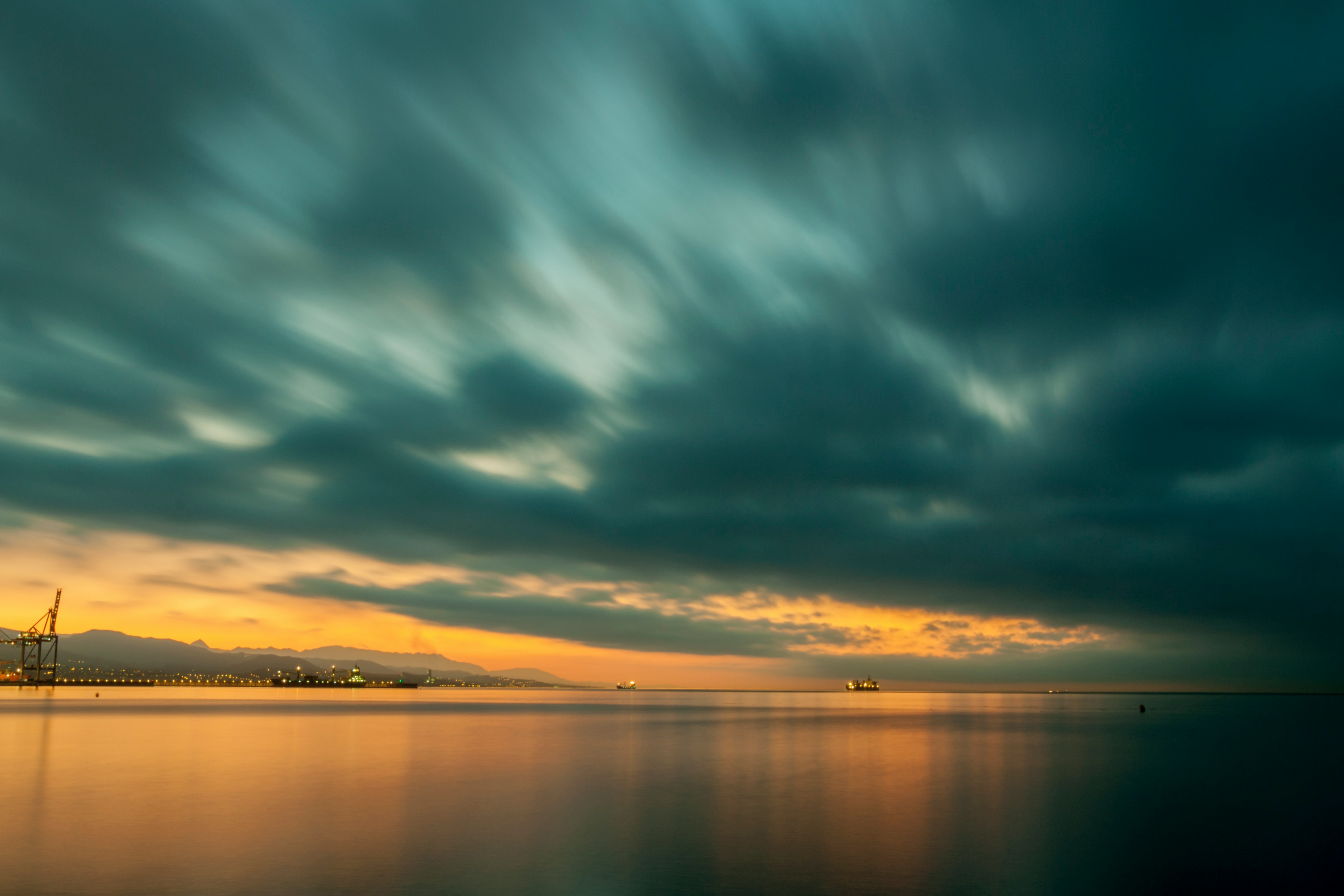 body of water under the cloudy sky