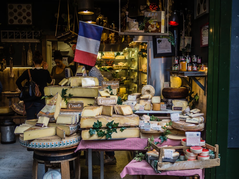 A stall with various types of French cheese